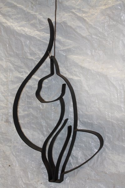 Abstract female figure silhouette in wrought iron
