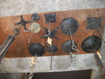 Display of handcrafted wrought iron sconces and hooks