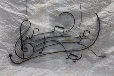 Musical notes and staff in wrought iron
