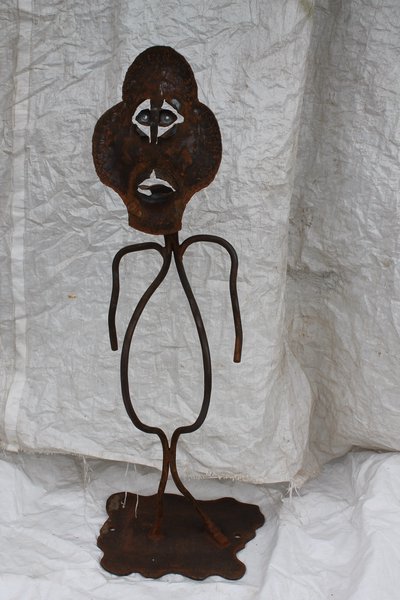 Figurative wrought iron sculpture with face
