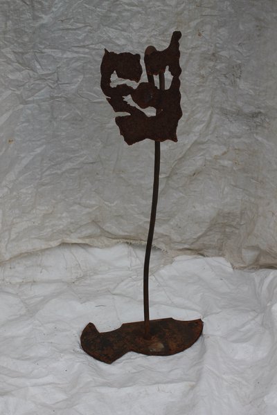 Rustic wrought iron flower sculpture