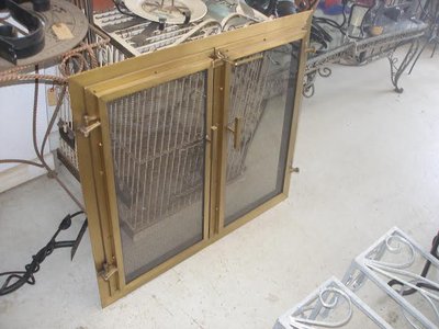 Brass fireplace screen with mesh doors
