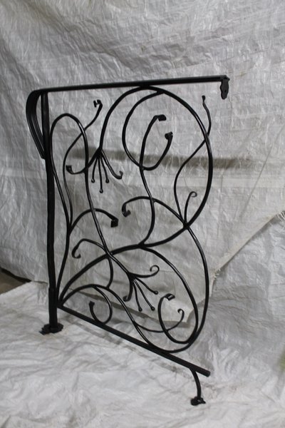 Wrought iron fireplace screen with vine scrollwork