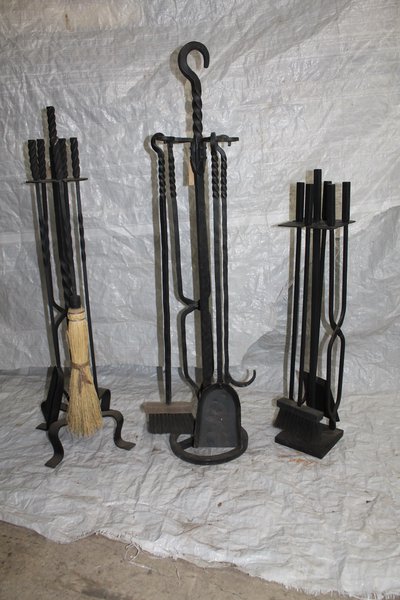 Three wrought iron fireplace tool sets