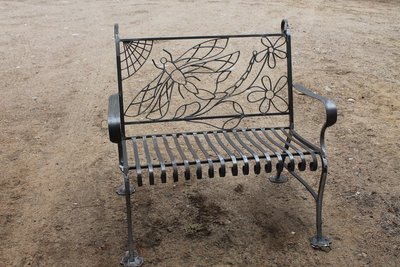 Wrought iron bench with dragonflies, front view