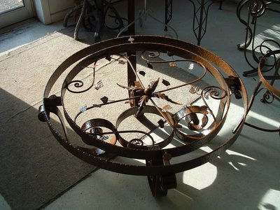 Round wrought iron table base with scrollwork