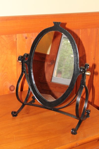 Oval wrought iron vanity mirror