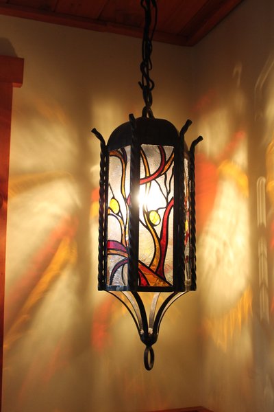 Wrought iron lantern with colorful stained glass