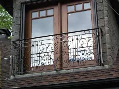 Ornate wrought iron balcony railing with scrollwork