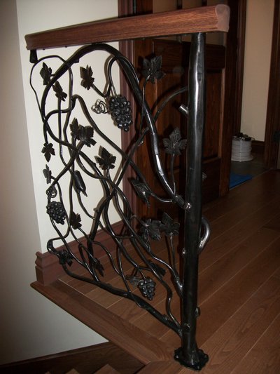 Wrought iron railing with grapevines and grape clusters