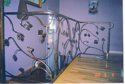 Staircase railing with grapevine and grape motifs