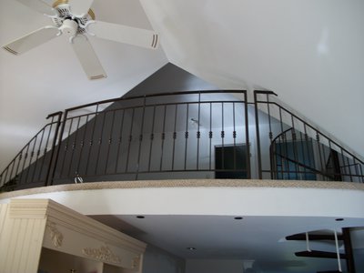 Wrought iron mezzanine railing with balusters