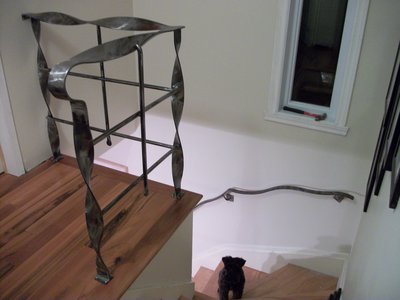 Modern staircase railing with sculptural twisted bars