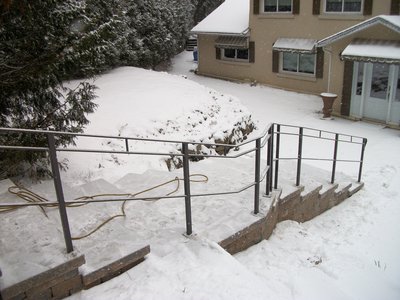 Outdoor metal handrail for exterior steps