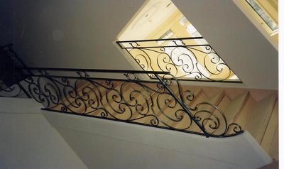 Classic wrought iron staircase railing with scrollwork