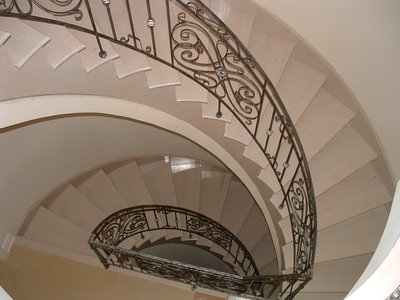Grand spiral staircase wrought iron railing, overhead view