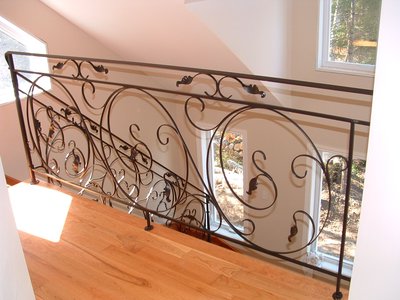Wrought iron railing with scrollwork and leaf motifs