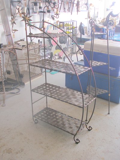 Wrought iron spiral staircase with vine motifs